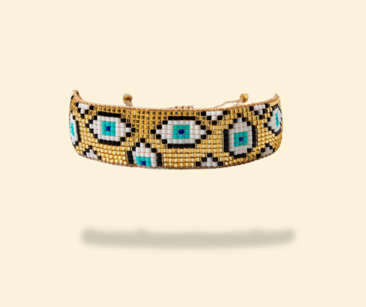 Pulsera dorada ojo